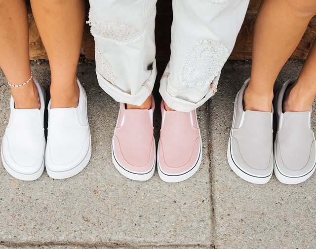 Close-up of white, pink, and grey slip-on zero drop shoes from Splay, designed for comfort and effortless style.