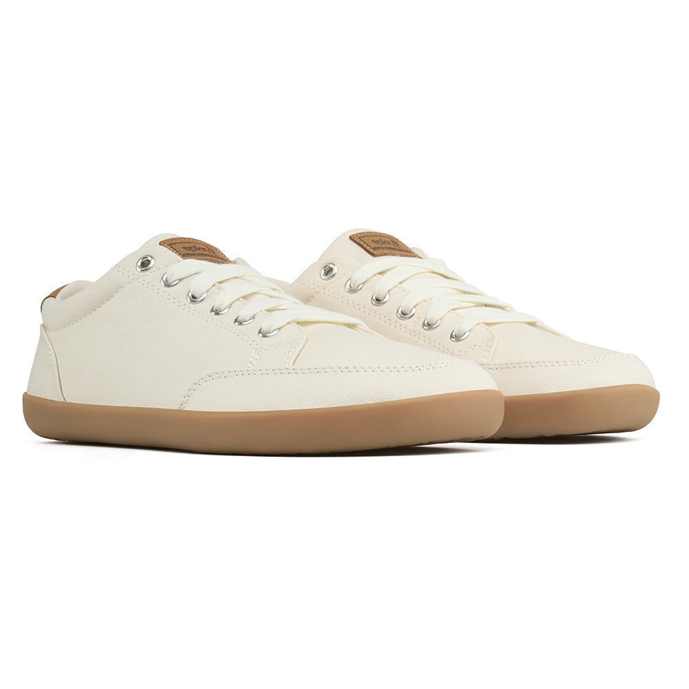 Pair of light tan FREESTYLE 3 Almond sneakers with brown accents and brown gumsole on a white background