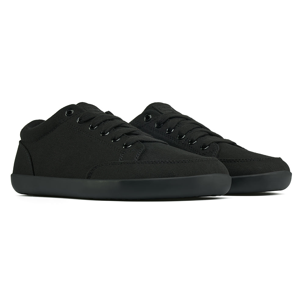 Front angle view of the FREESTYLE 3 Jet, Black sneaker with black laces, and black outsole, on a white background