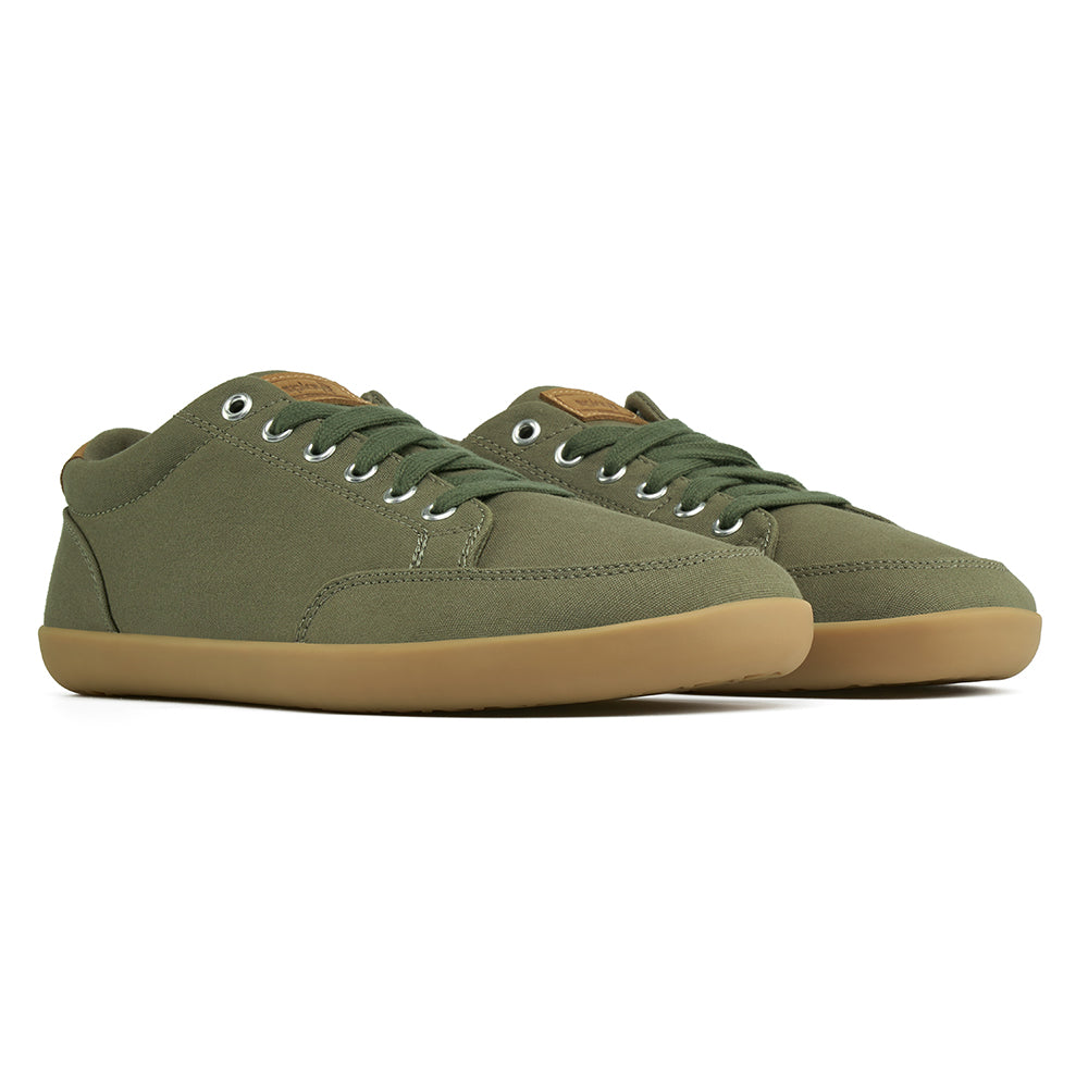 Front angle view of the FREESTYLE 3 Pine, Pine green sneaker with matching green laces, and brown gumsole, on a white background