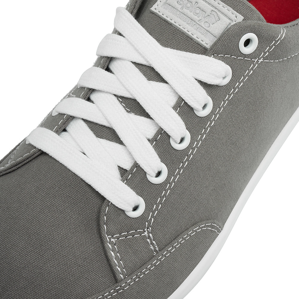 Close up view of the top and laces on the FREESTYLE 3 Stone, grey sneaker with white laces and light grey accents on a white background