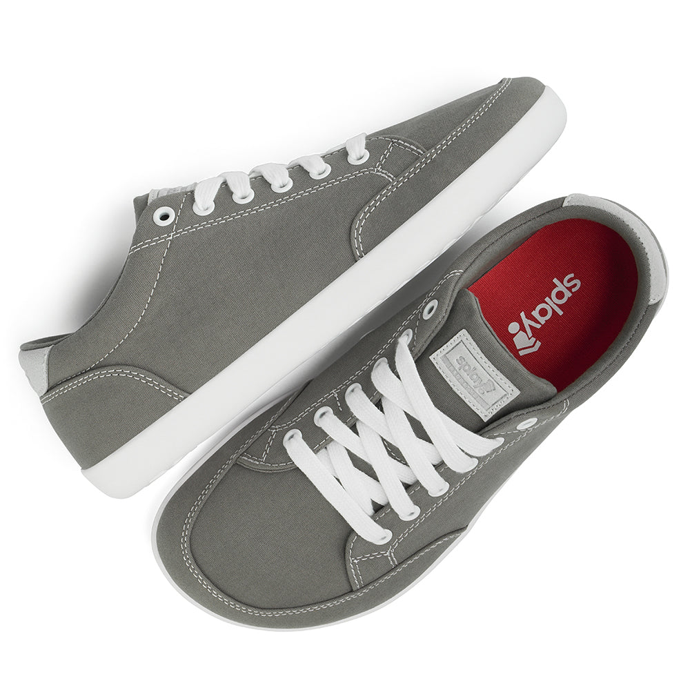 Top and Side view picture of the FREESTYLE 3 Stone, grey sneaker with white laces, and white outsole on a white background, shows red insole with the Splay logo.