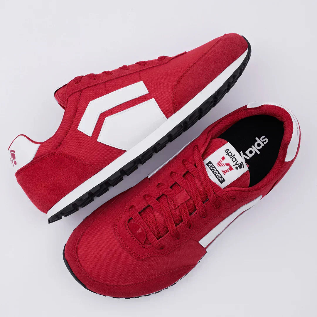 Bright red RUNNER V1 barefoot running shoe with a wide toe box and flexible sole by Splay.