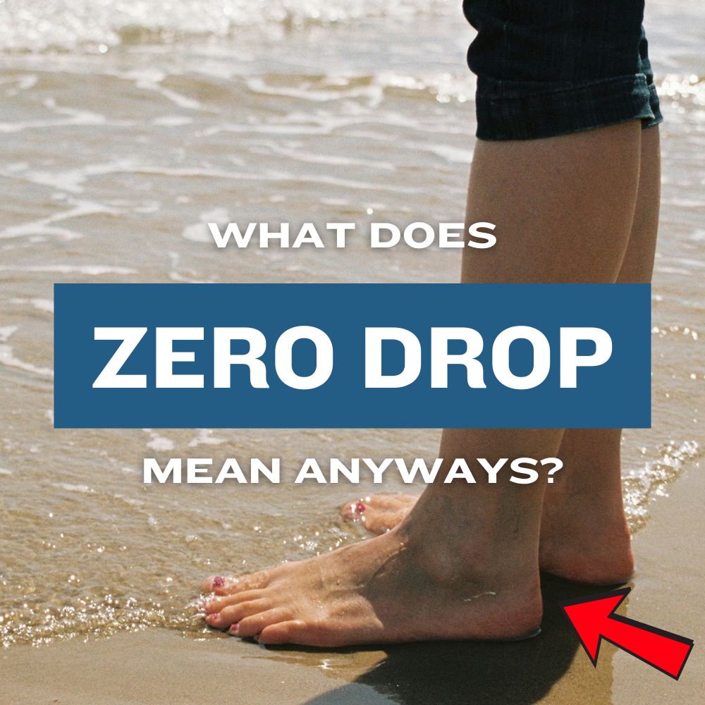 Bare feet standing on wet sand with text overlay "What Does Zero Drop Mean Anyways?" highlighting zero drop shoe benefits.