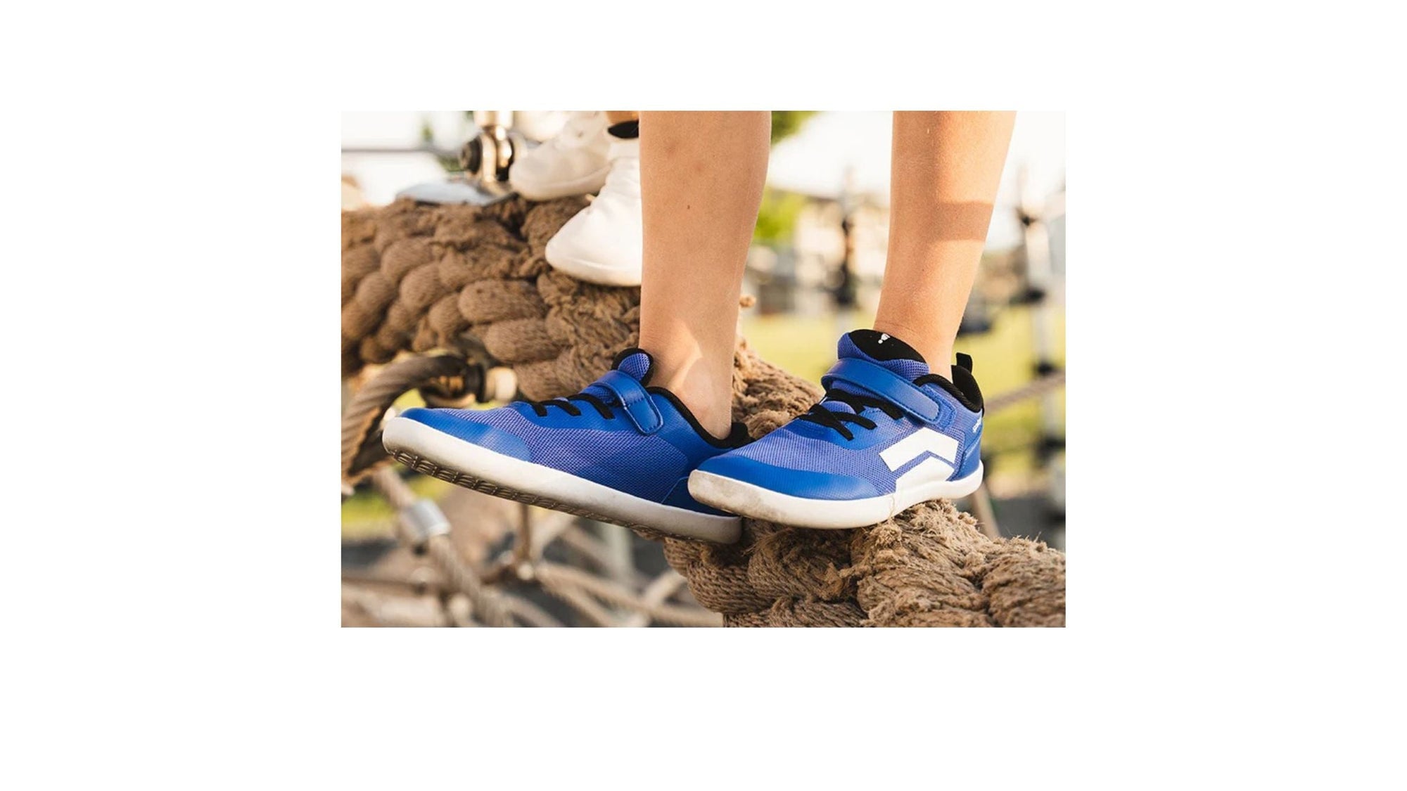 A child wearing DASH True Blue Barefoot Shoes from Splay Shoes. 