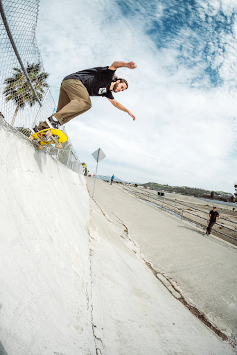 A man wearing a Splay barefoot shoe while skateboarding, showing natural foot movement and board control.