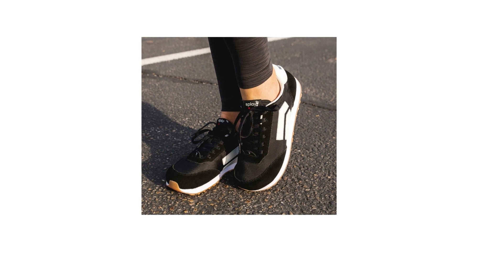 Splay Runner V1 shoes in Classic Navy placed on a wooden bench outdoors.