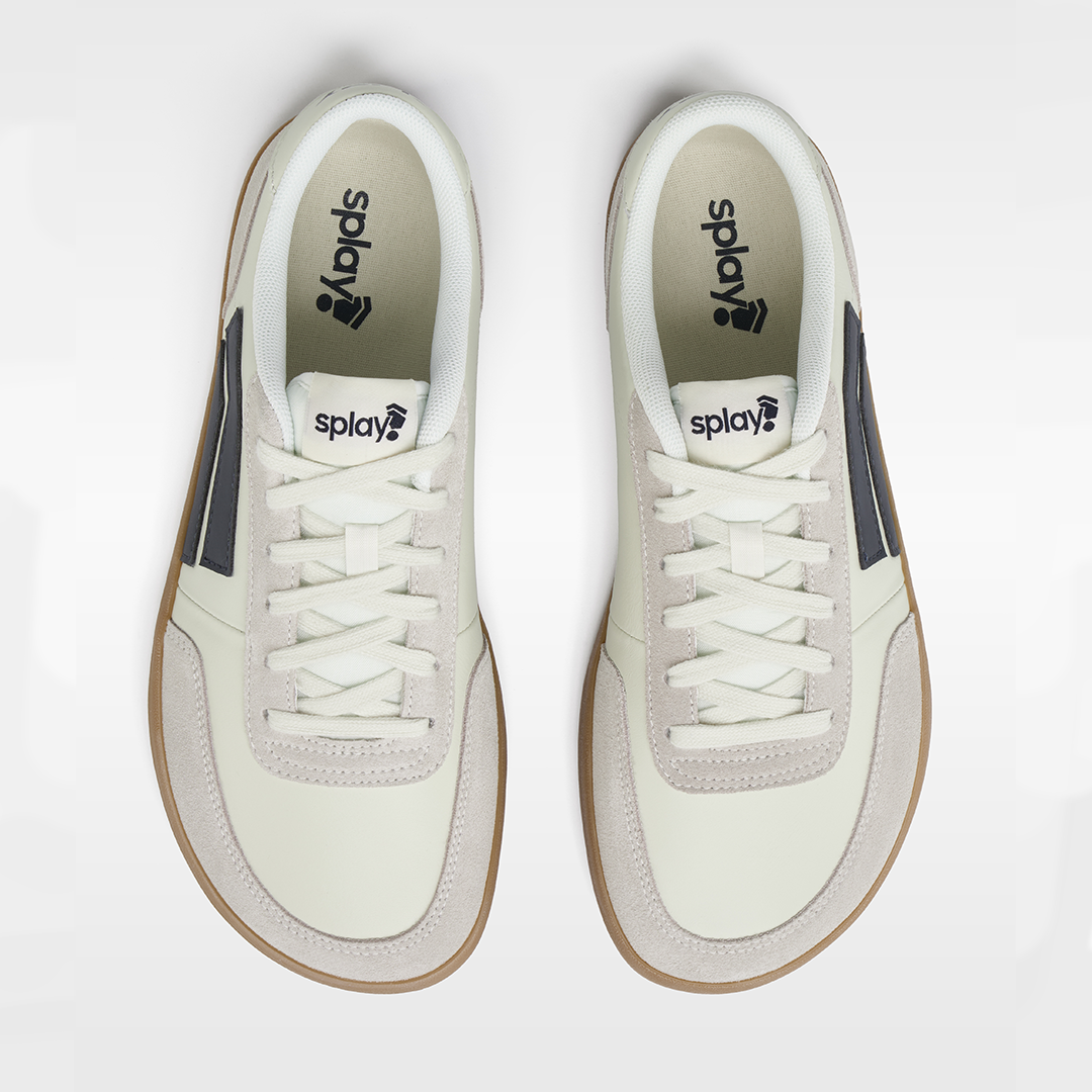 White sneakers with brown accents on a white background