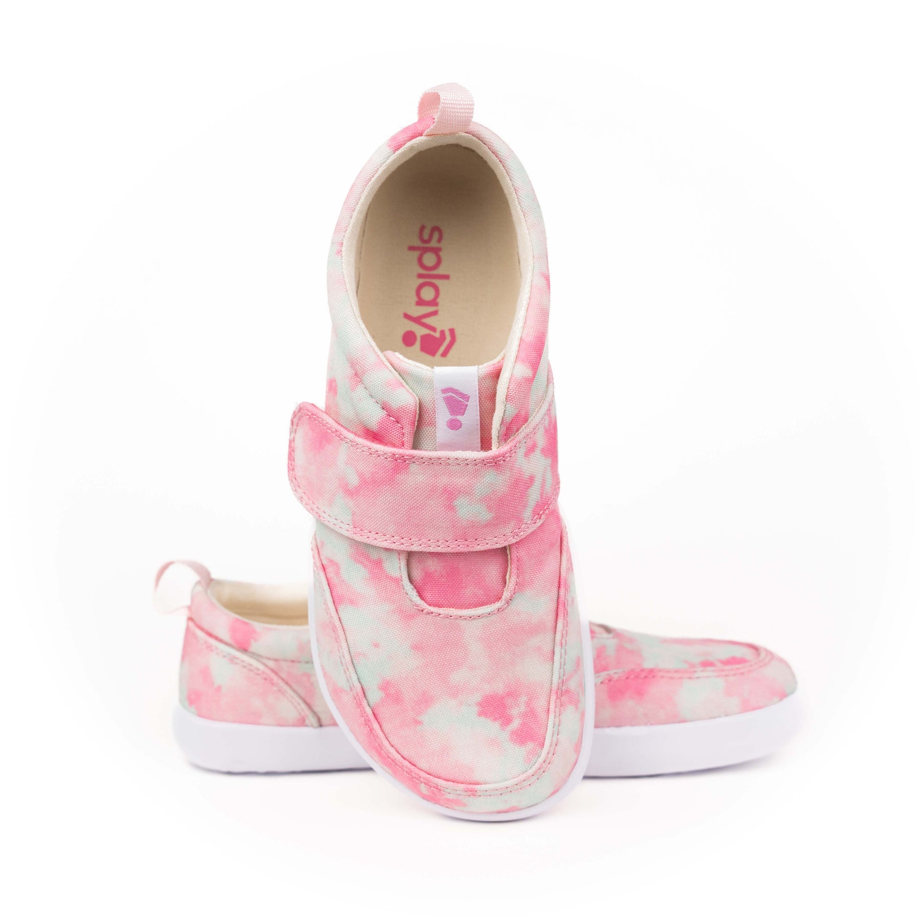 Kids' pink and white tie-dye zero drop shoe with velcro strap and white sole promoting healthy walking.