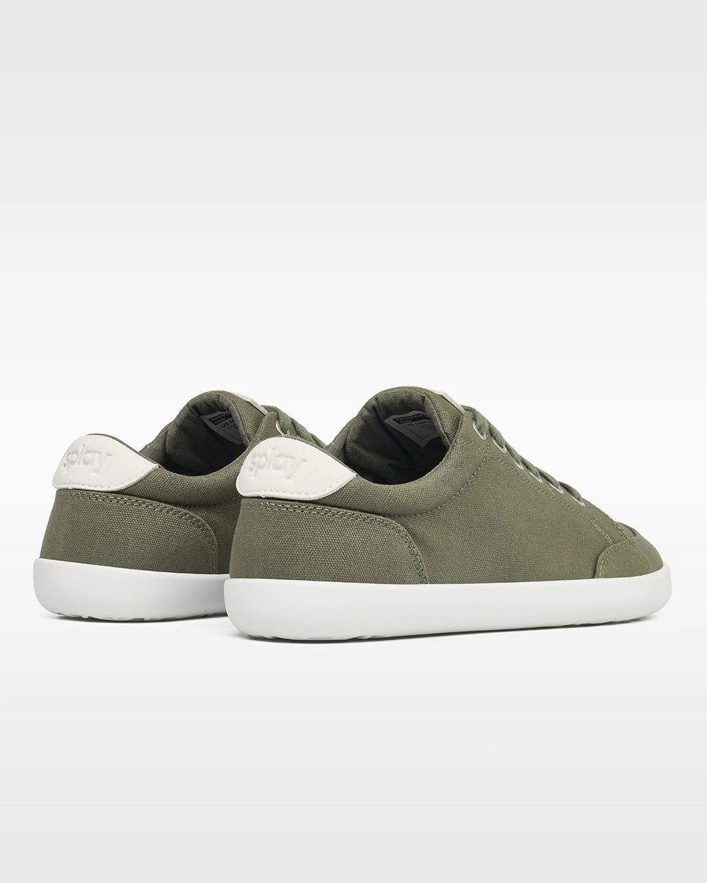 Rear three-quarter view of Splay FREESTYLE Sage '26 green canvas barefoot sneakers showing white Splay heel branding.