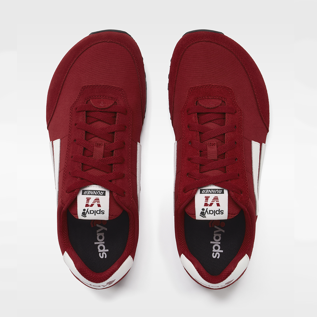 Red sneakers with white soles on a white background