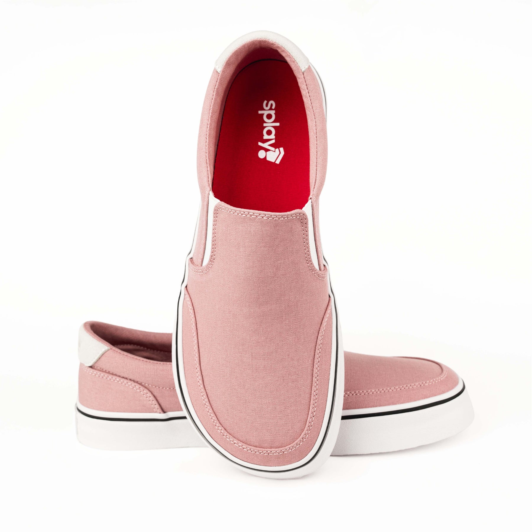 Close-up of pink Splay STREESTYLE SLIP-ON shoes, showcasing the soft fabric, white sole, and red interior with the Splay logo.