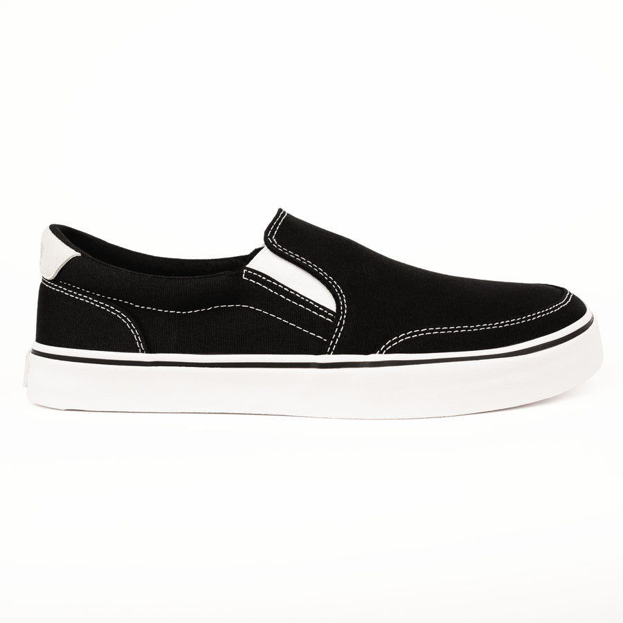 Side view of black slip-on zero drop shoes from Splay with white stitching and flexible sole.