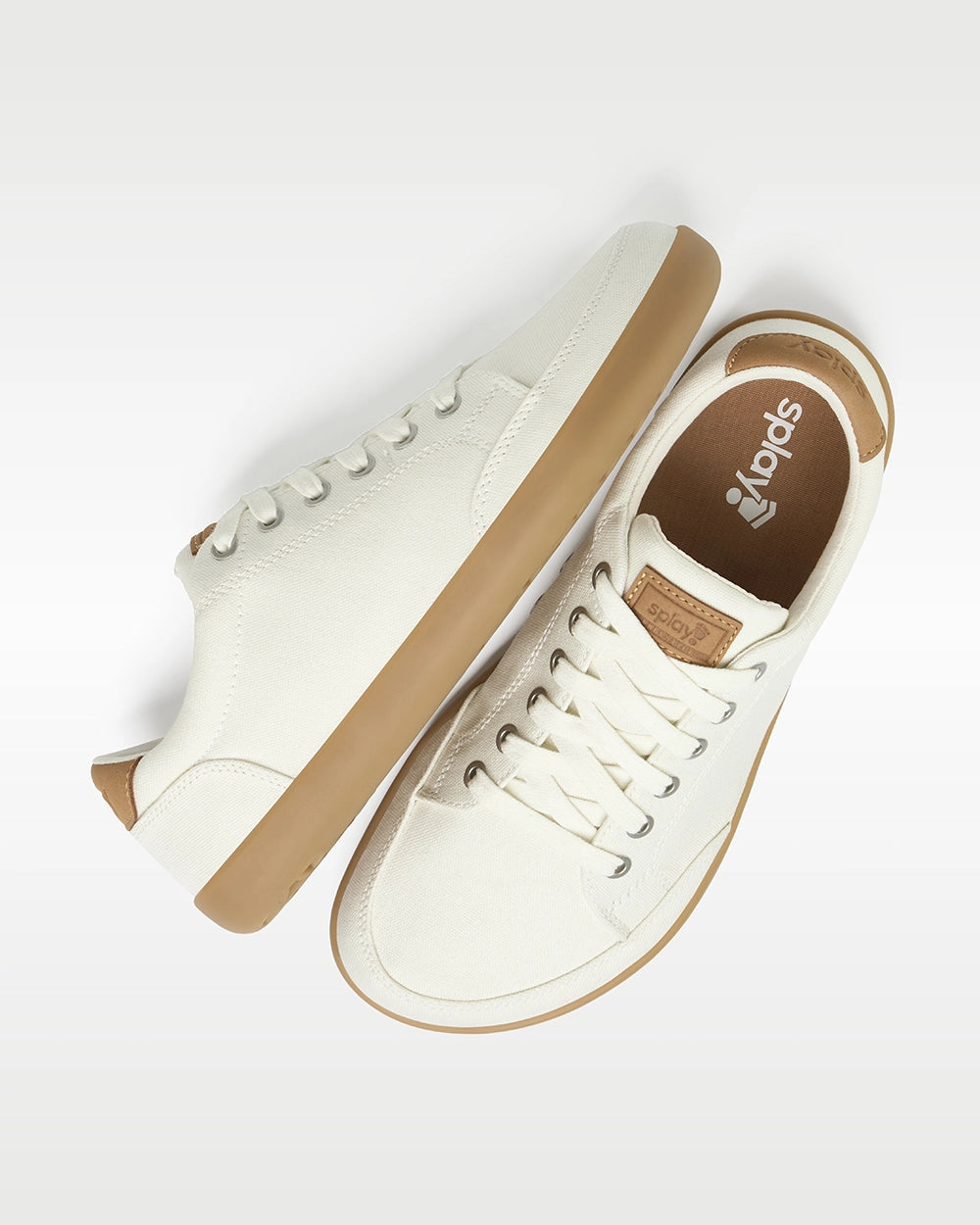Top and side view of Splay FREESTYLE Almond '26 cream canvas barefoot sneakers with gum soles and Splay-branded insoles.