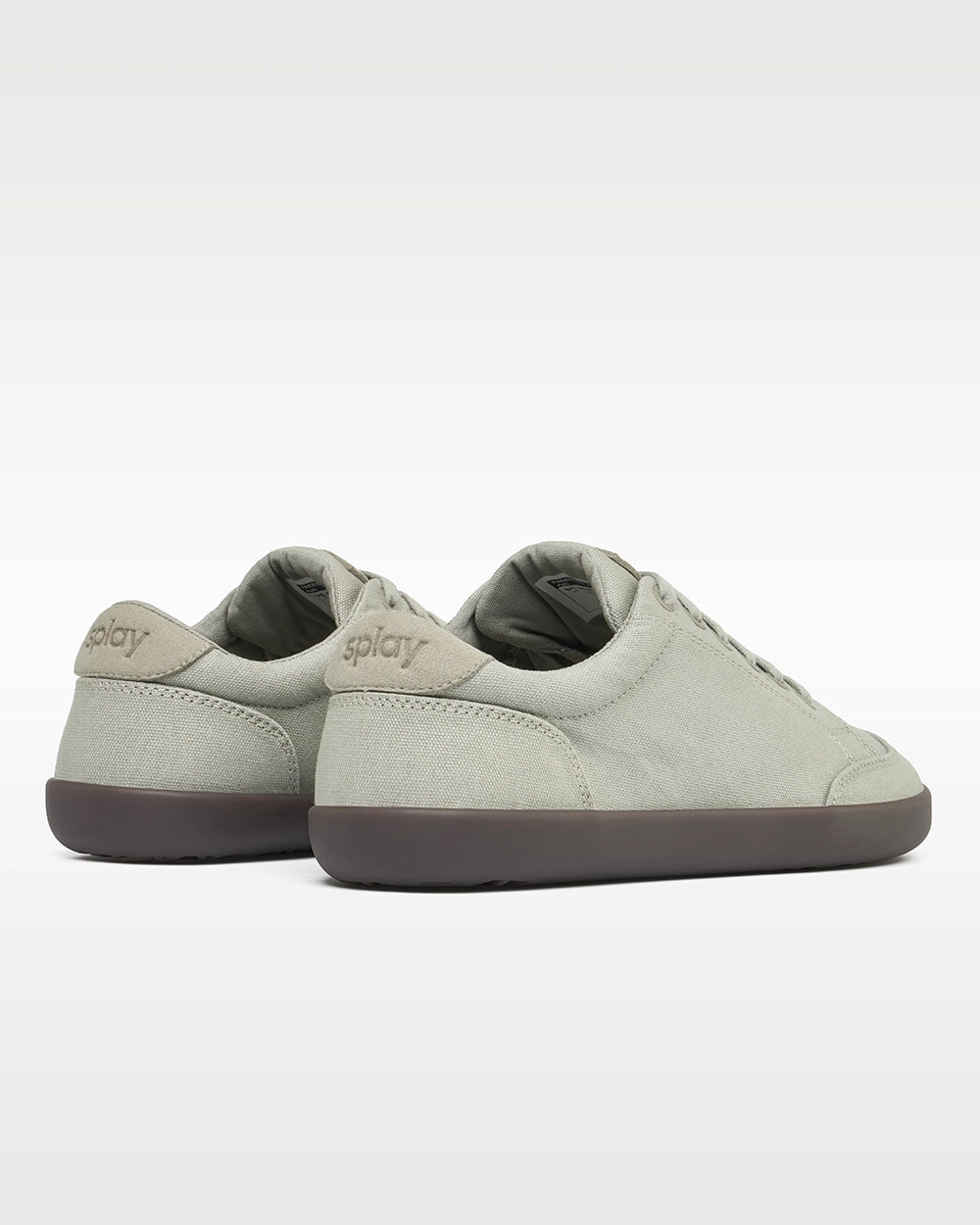 Rear three-quarter view of Splay FREESTYLE Ash '26 light gray canvas barefoot sneakers showing tonal Splay heel branding.