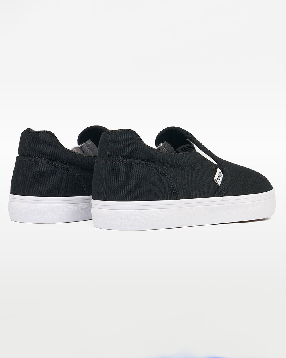 Splay REV SO Berlin barefoot shoes — canvas slip-on, pair viewed from behind, heels toward the camera
