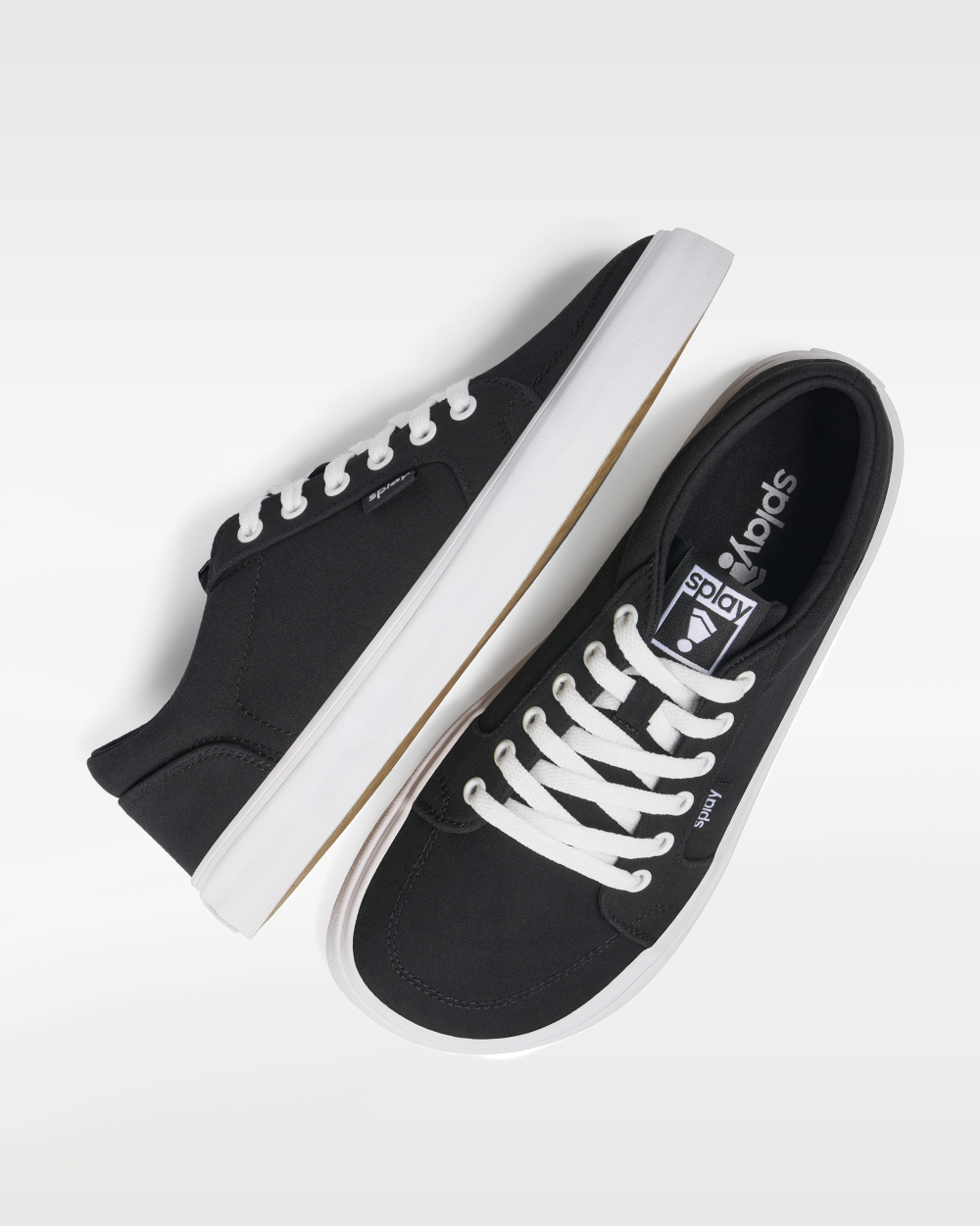 Splay REV LT Canvas Berlin barefoot shoes — low-top skate shoe, pair shot from above, one shoe tipped up to show the insole