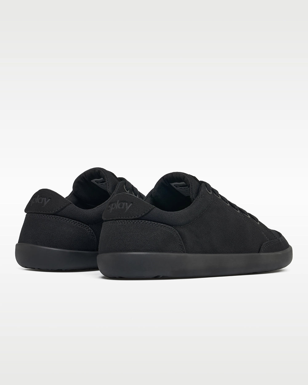 Rear three-quarter view of Splay FREESTYLE Jet '26 black canvas barefoot sneakers showing tonal Splay heel branding.
