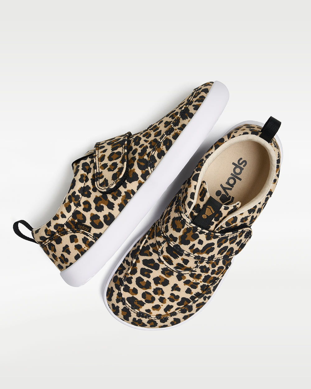Splay Explore Kids Leopard barefoot shoes — kids' low-top shoe with a hook-and-loop strap, pair shot from above, one shoe tipped up to show the insole