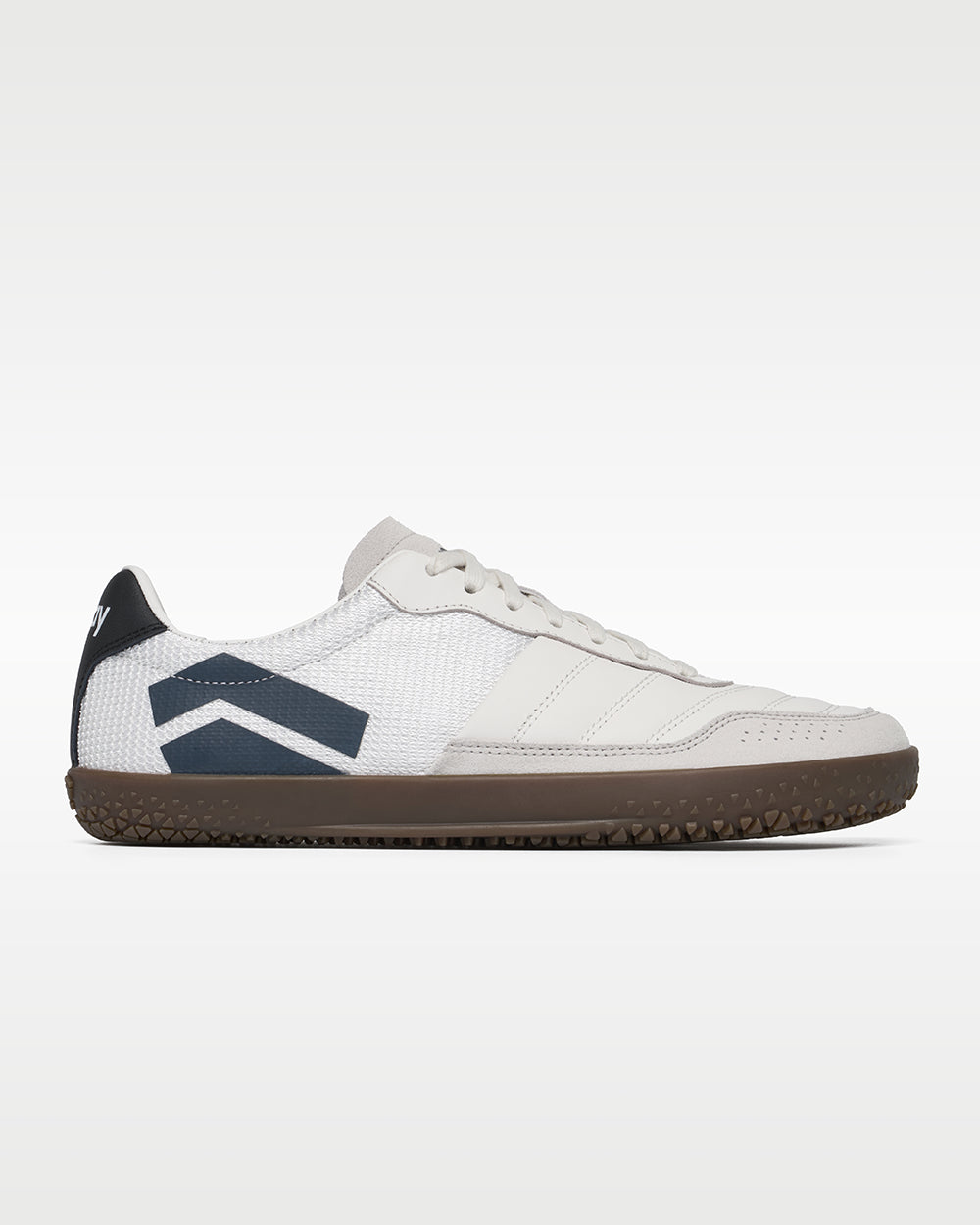 DOMINARI Lux barefoot shoes — low-top indoor soccer shoe with a gum sole, single shoe in left-side profile