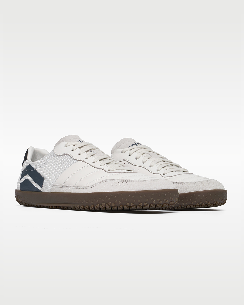 DOMINARI Lux barefoot shoes — low-top indoor soccer shoe with a gum sole, pair in an angled three-quarter view from the front