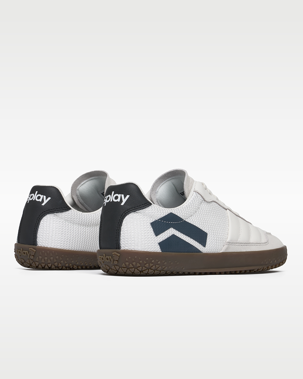 DOMINARI Lux barefoot shoes — low-top indoor soccer shoe with a gum sole, pair viewed from behind, heels toward the camera