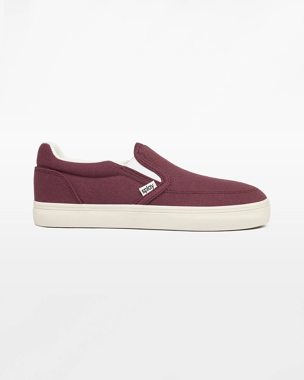 Side view of a burgundy Splay Kids REV SO Madrid canvas barefoot slip-on shoe with a white sole.