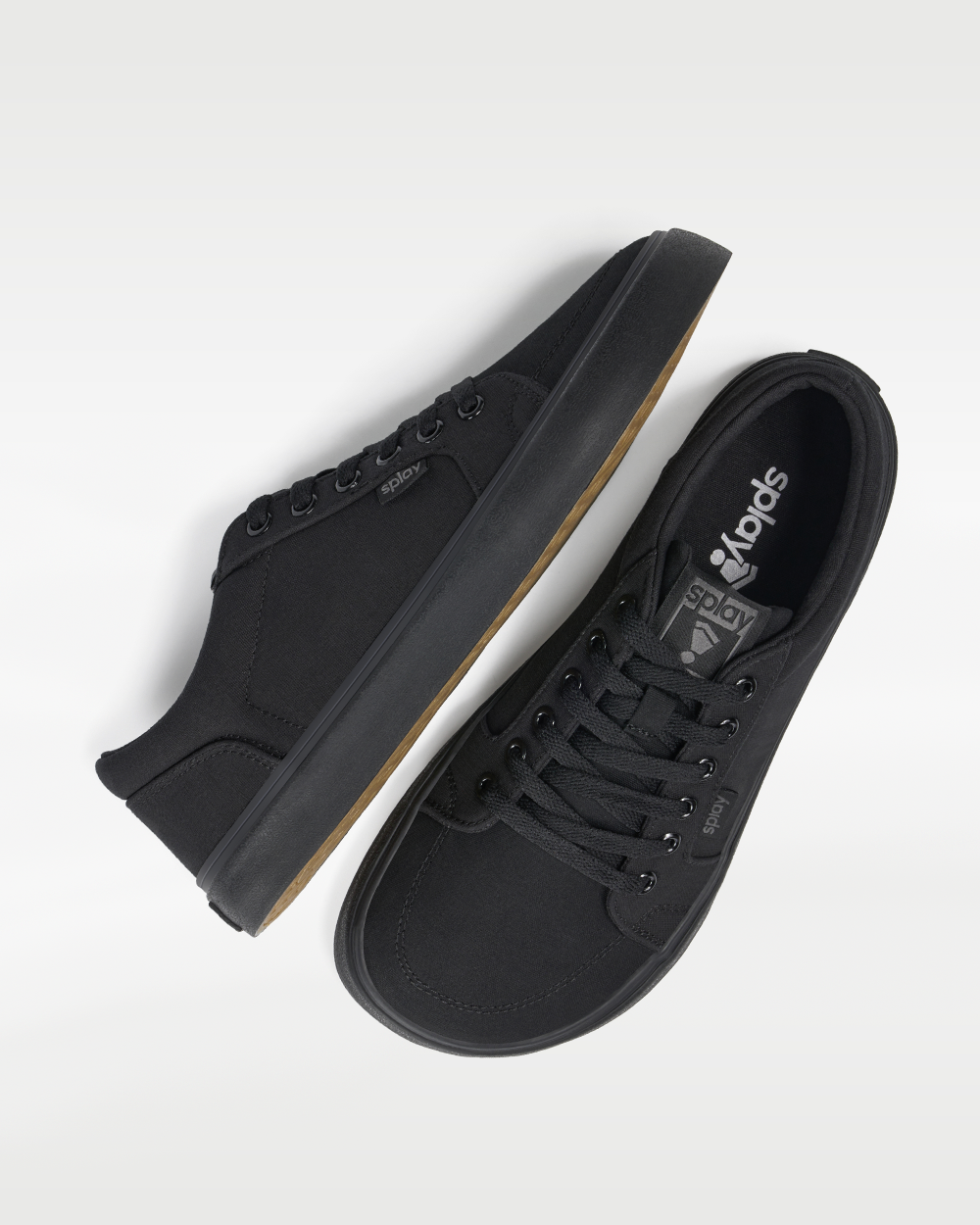 Splay REV LT Canvas New York barefoot shoes — low-top skate shoe, pair shot from above, one shoe tipped up to show the insole