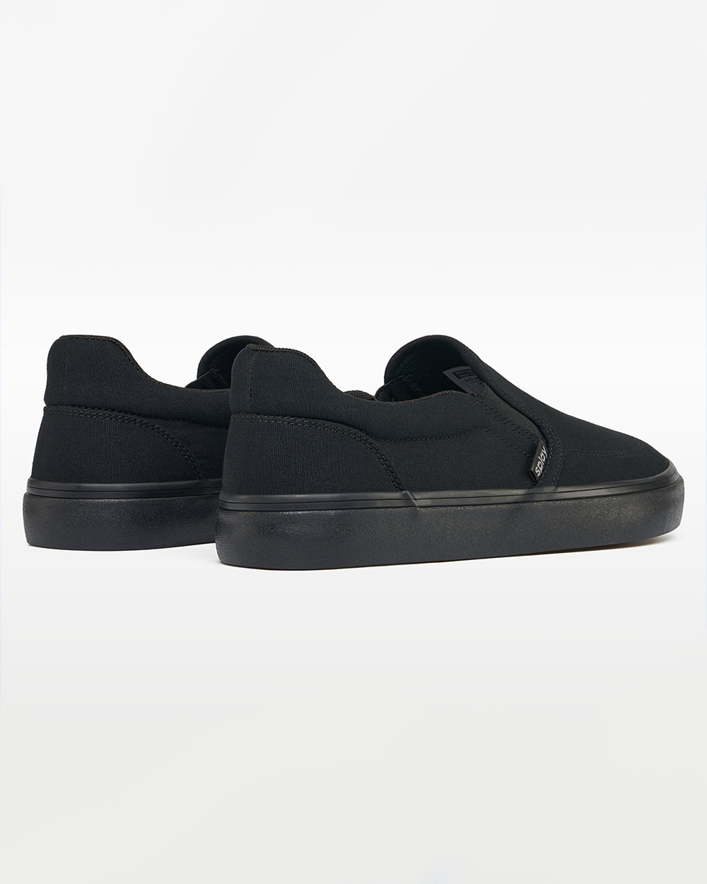 Splay REV SO New York barefoot shoes — canvas slip-on, pair viewed from behind, heels toward the camera