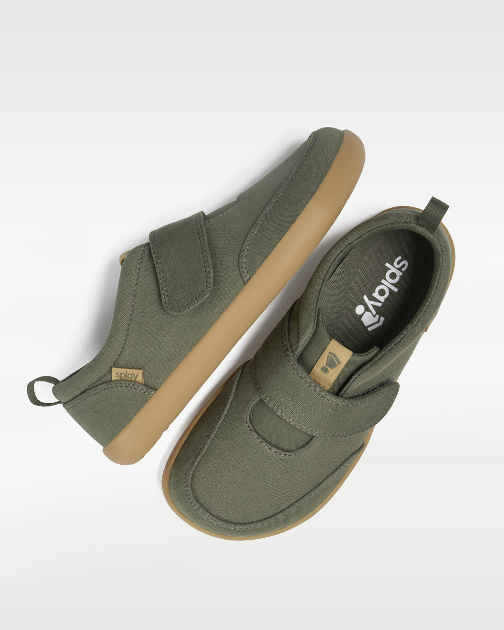Splay Explore Kids Pine barefoot shoes — kids' low-top shoe with a hook-and-loop strap, pair shot from above, one shoe tipped up to show the insole