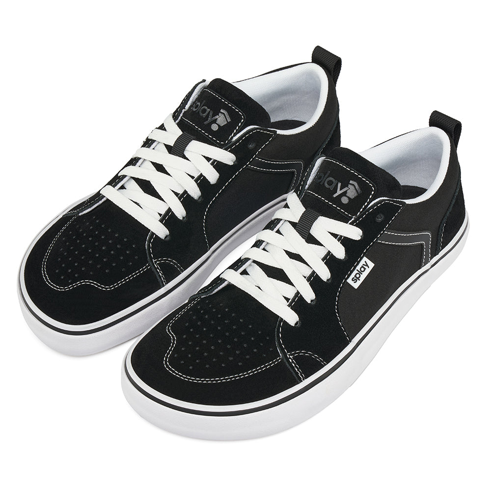 Top-down view of black REV LTS Los Angeles sneakers with white stitching and “REV” branding on the tongue, on a white background.