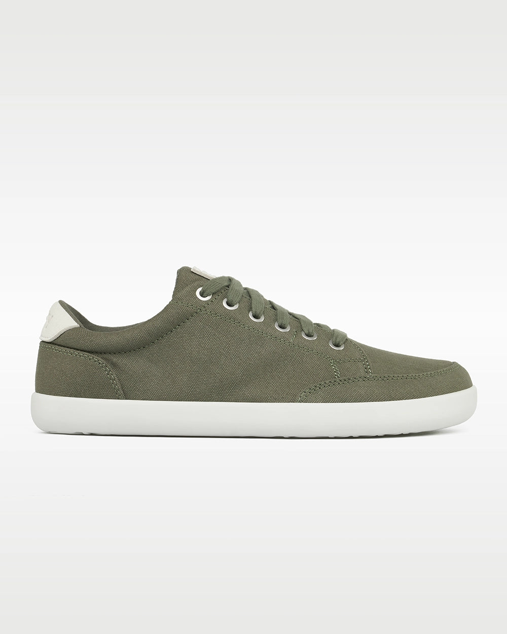 Side profile of the Splay FREESTYLE Sage '26 green canvas barefoot sneaker with a white outsole and white heel accent.